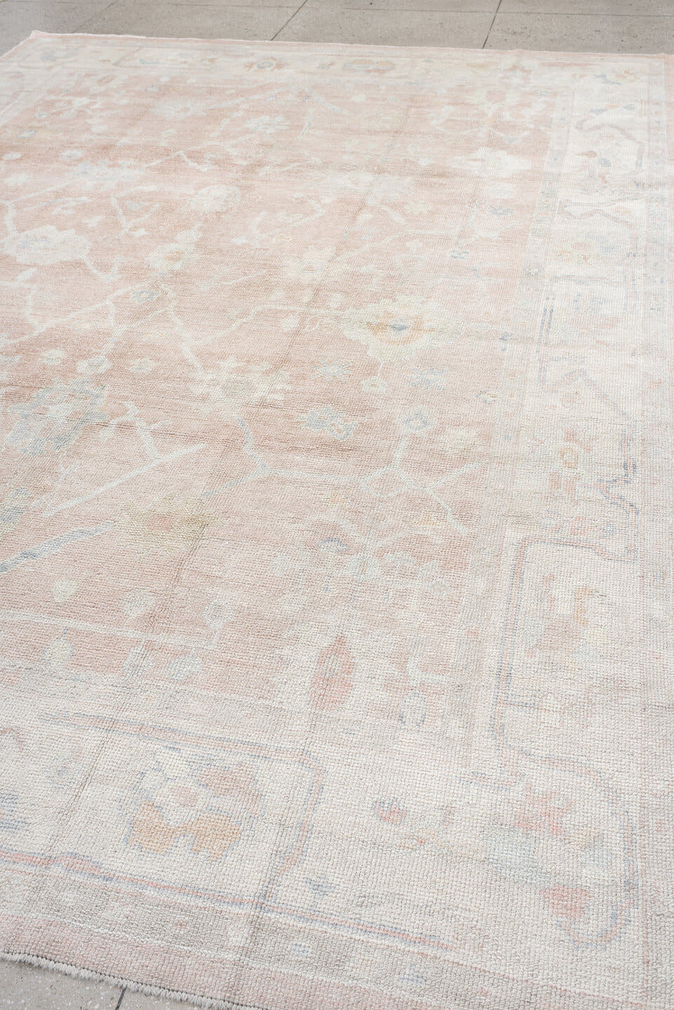 9' x 12' one-of-a-kind handmade vintage Oushak large size rug. Color palette: blush, ivory, cream, pale blue, taupe, peach