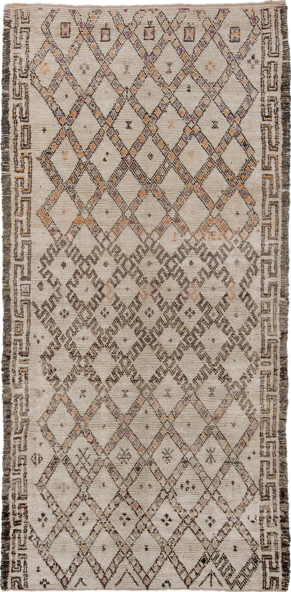 5' x 11' one-of-a-kind handmade vintage Moroccan rug. Color palette: black, brown, gray, light gray, off-white, pink, snow