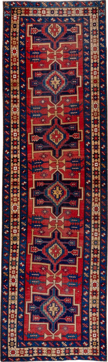 3' x 10' one-of-a-kind handmade vintage Heriz runner rug. Color palette: brown, gray, pink, red