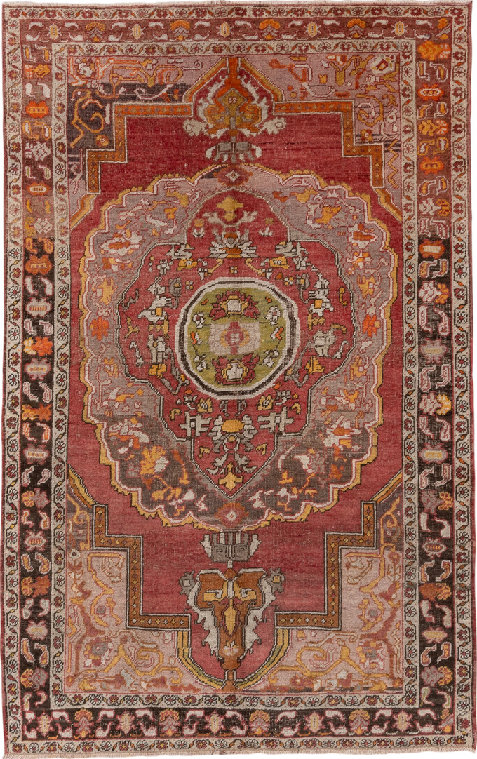 5' x 8' one-of-a-kind handmade vintage Oushak medium size rug. Color palette: brown, gray, pink