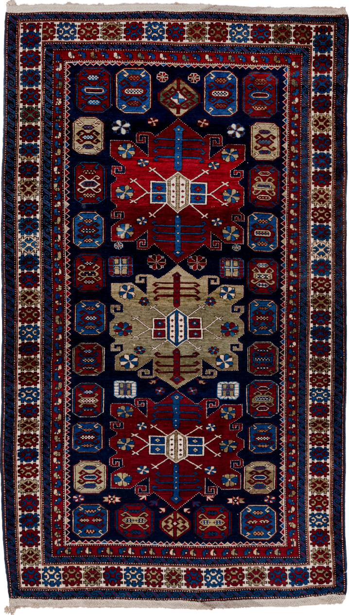 4' x 7' one-of-a-kind handmade vintage Caucasian rug. Color palette: black, blue, brown, gray, light gray, off-white, red