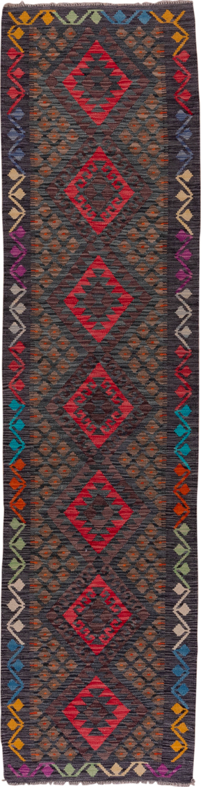 2' x 9' one-of-a-kind handmade vintage Kilim runner rug. Color palette: black, blue, brown, gray, pink, red, yellow