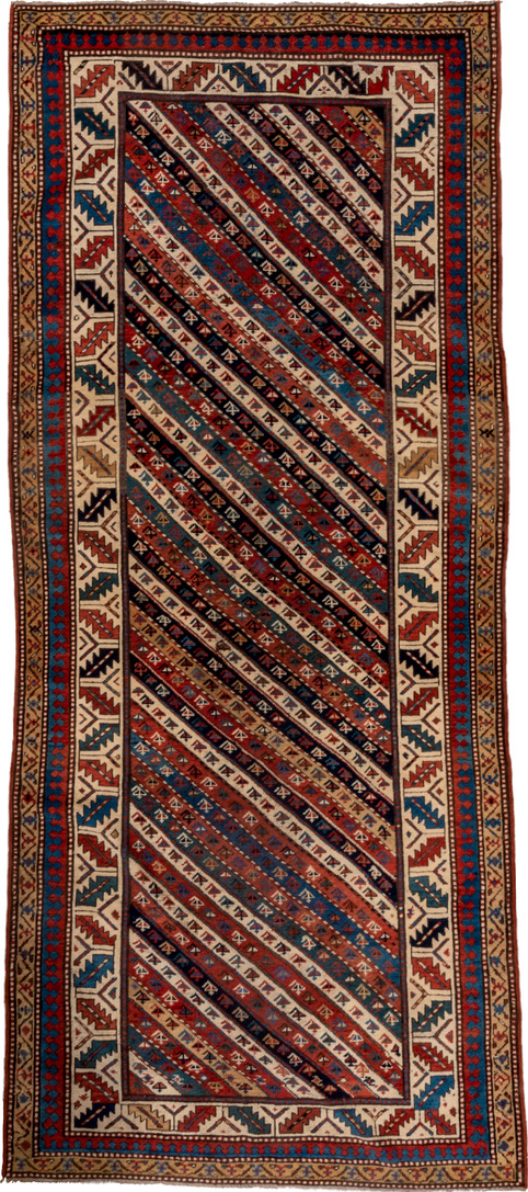 4' x 9' one-of-a-kind handmade vintage Kazak runner rug. Color palette: arapawa, black, blue, brown, gray, orange, red, tan