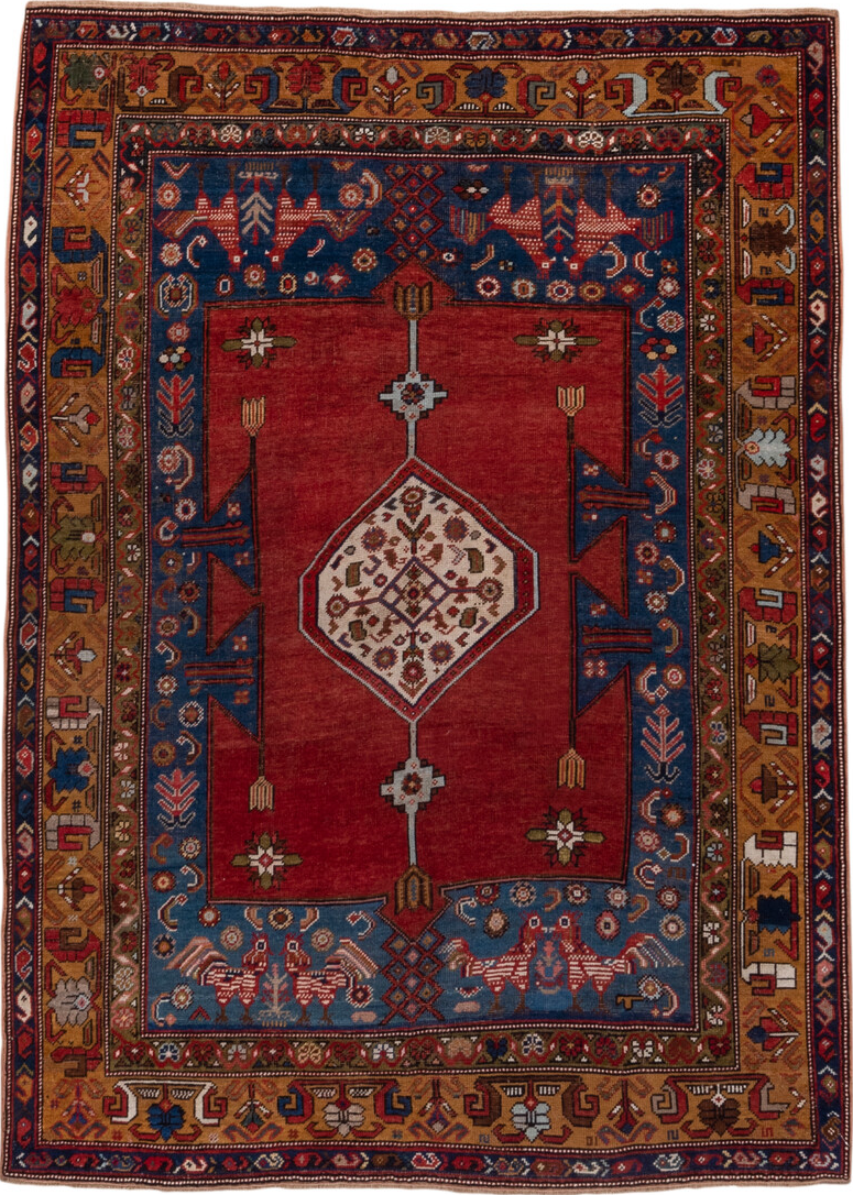 5' x 6' one-of-a-kind handmade vintage Caucasian rug. Color palette: blue, brown, gray, pink, red