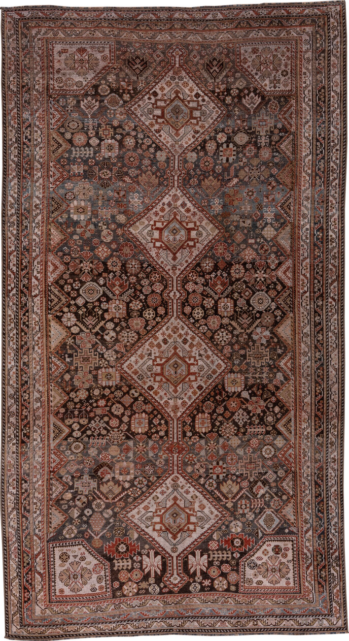 5' x 10' one-of-a-kind handmade vintage Qashqai medium size rug. Color palette: black, brown, gray, pink, redwood