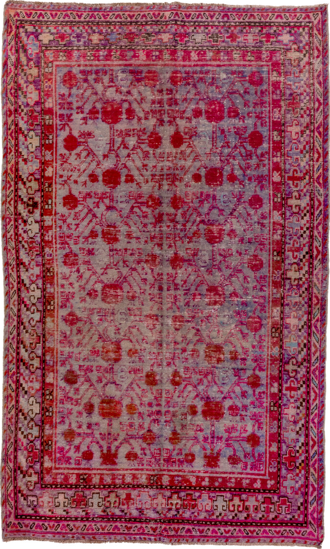 5' x 9' one-of-a-kind handmade vintage Khotan medium size rug. Color palette: brown, pink, red, rosy brown