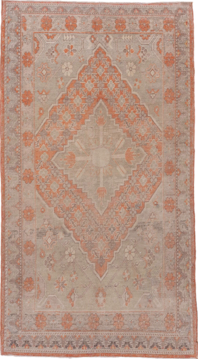 4' x 7' one-of-a-kind handmade vintage Khotan rug. Color palette: brown, gray, light gray, off-white, pink