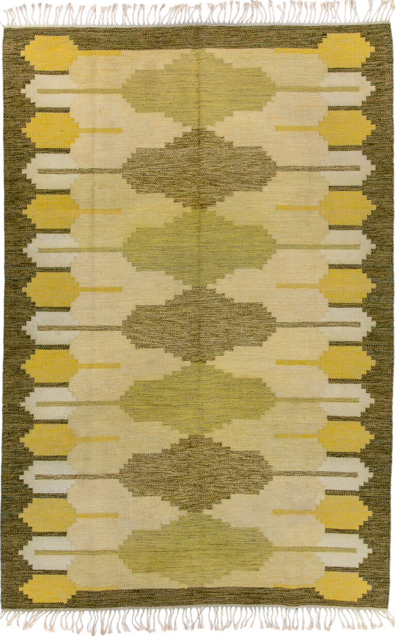 5' x 8' one-of-a-kind handmade vintage Rollaken medium size rug. Color palette: brown, off-white, orange, yellow