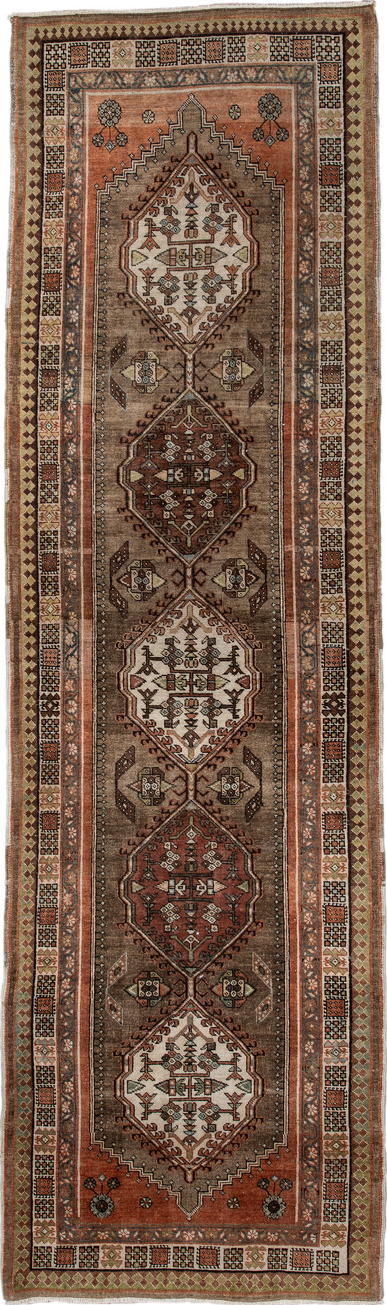 3' x 10' one-of-a-kind handmade vintage Sarab runner rug. Color palette: black, brown, gray, off-white, pink