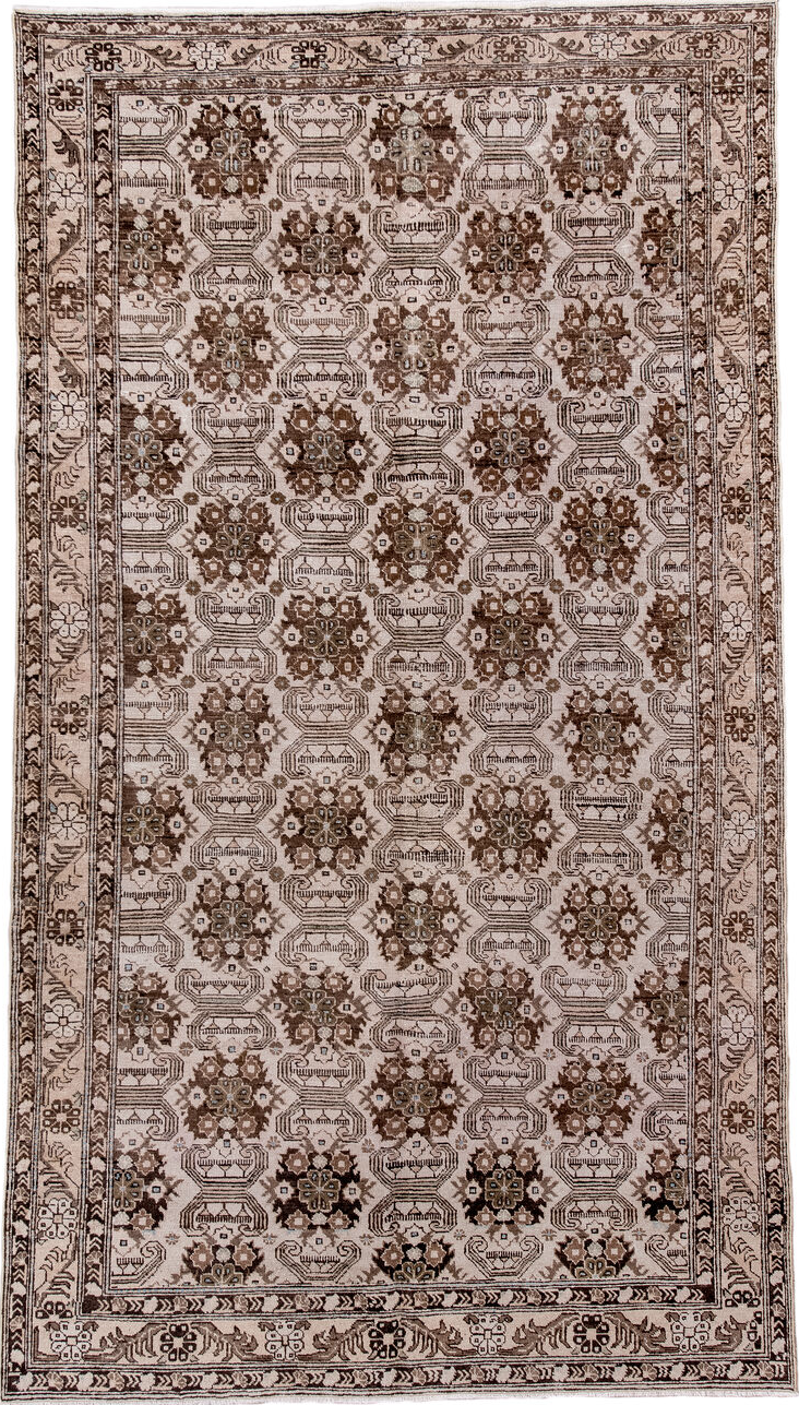 5' x 9' one-of-a-kind handmade vintage Tabriz medium size rug. Color palette: black, brown, gray, light gray, off-white