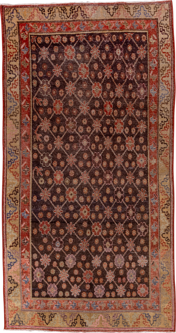 4' x 8' one-of-a-kind handmade vintage Khotan rug. Color palette: brown, pink, redwood