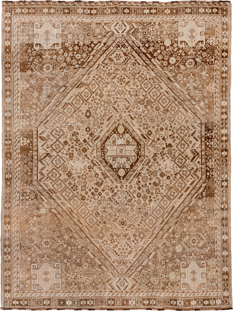 7' x 9' one-of-a-kind handmade vintage Shiraz rug. Color palette: brown, gray, light gray, off-white, orange, tan