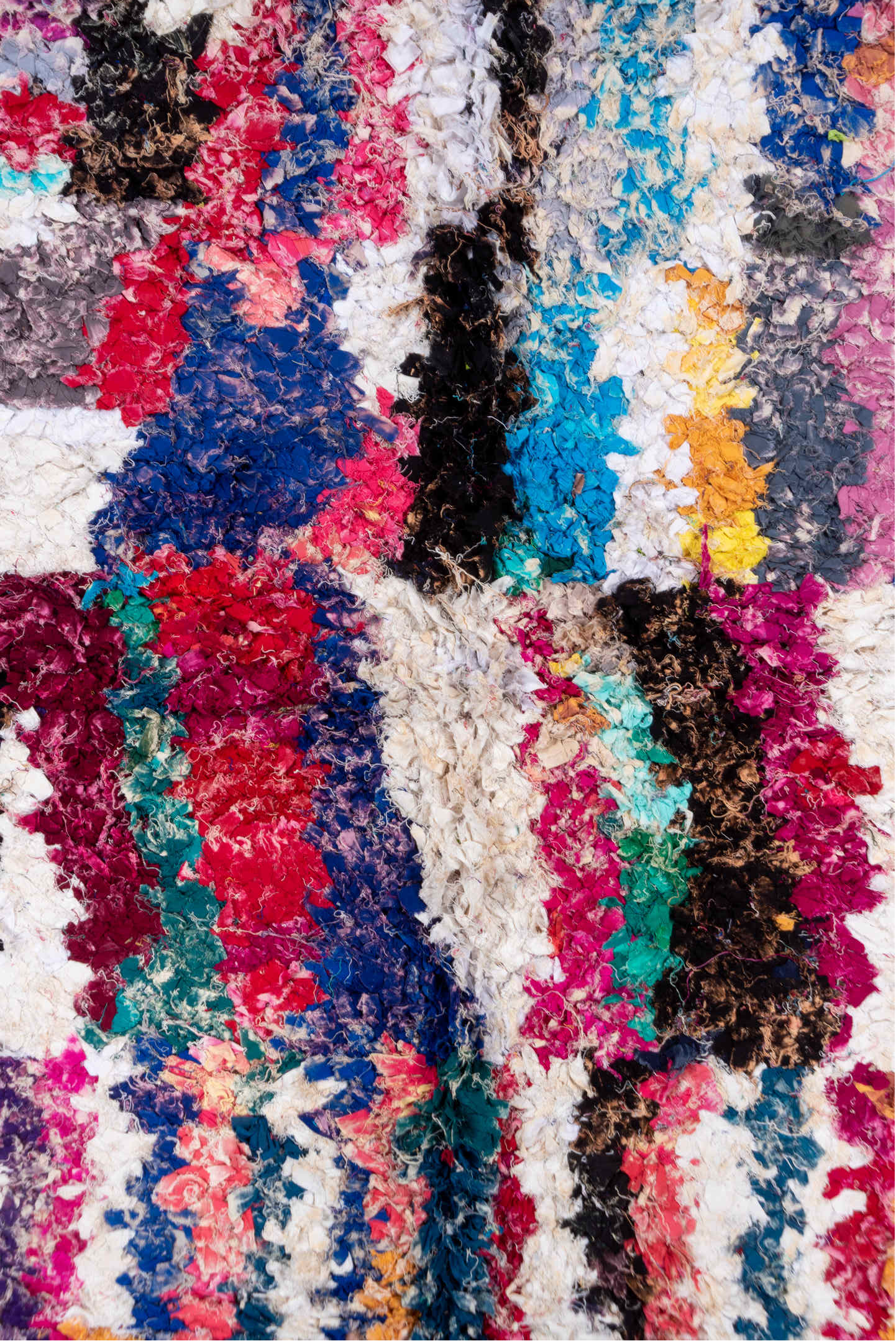 4' x 8' one-of-a-kind handmade vintage Rag Rug rug. Color palette: blue, brown, gray, green, light gray, off-white, pink