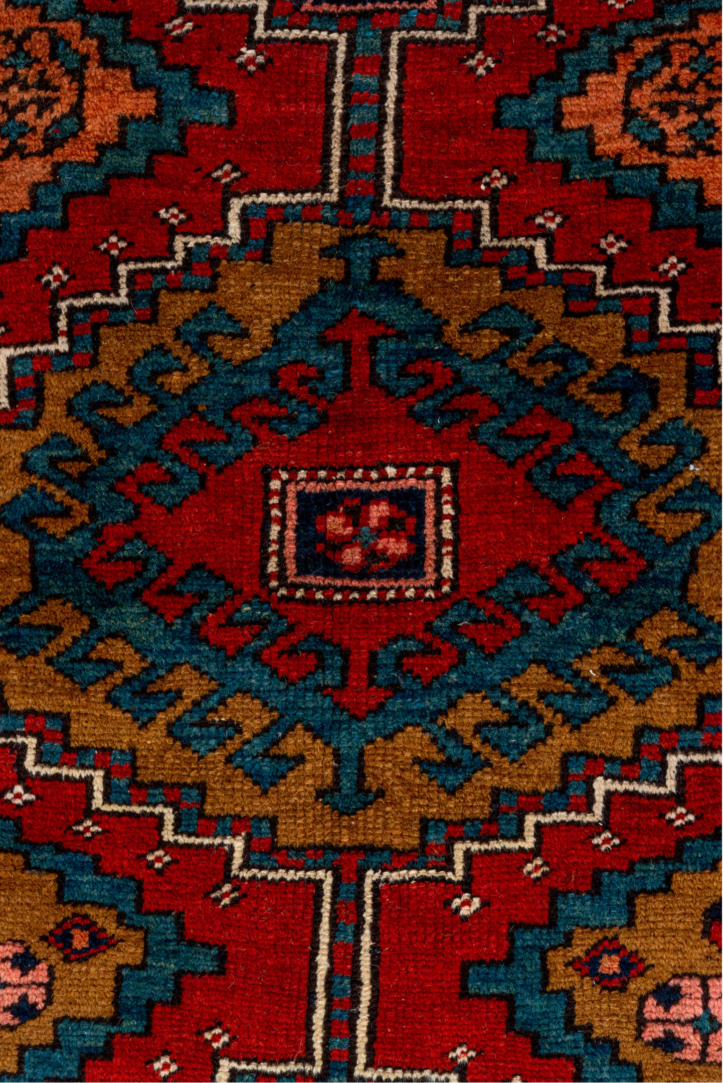 3' x 12' one-of-a-kind handmade vintage Heriz runner rug. Color palette: black, blue, brown, gray, maroon, pink, red