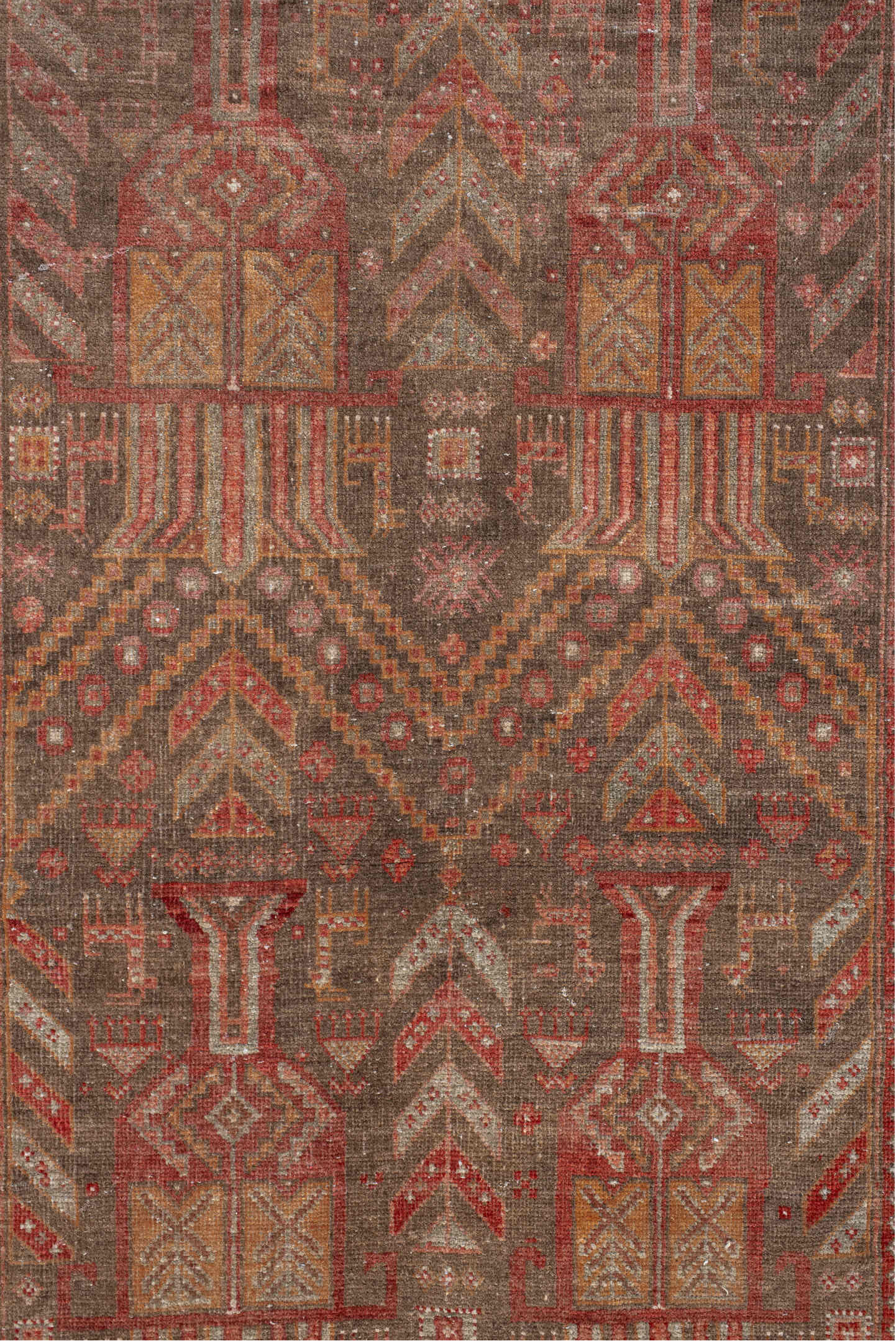 3' x 9' one-of-a-kind handmade vintage Belouch runner rug. Color palette: brown, gray, orange, pink, red