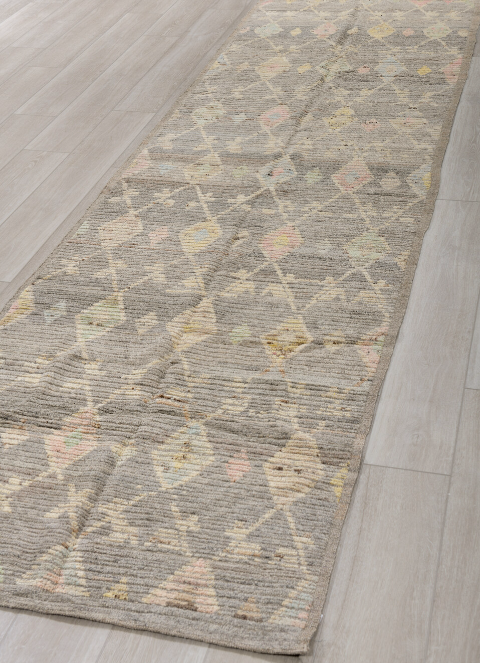 3' x 12' one-of-a-kind handmade vintage Tulu runner rug. Color palette: brown, gray, light gray, off-white, silver