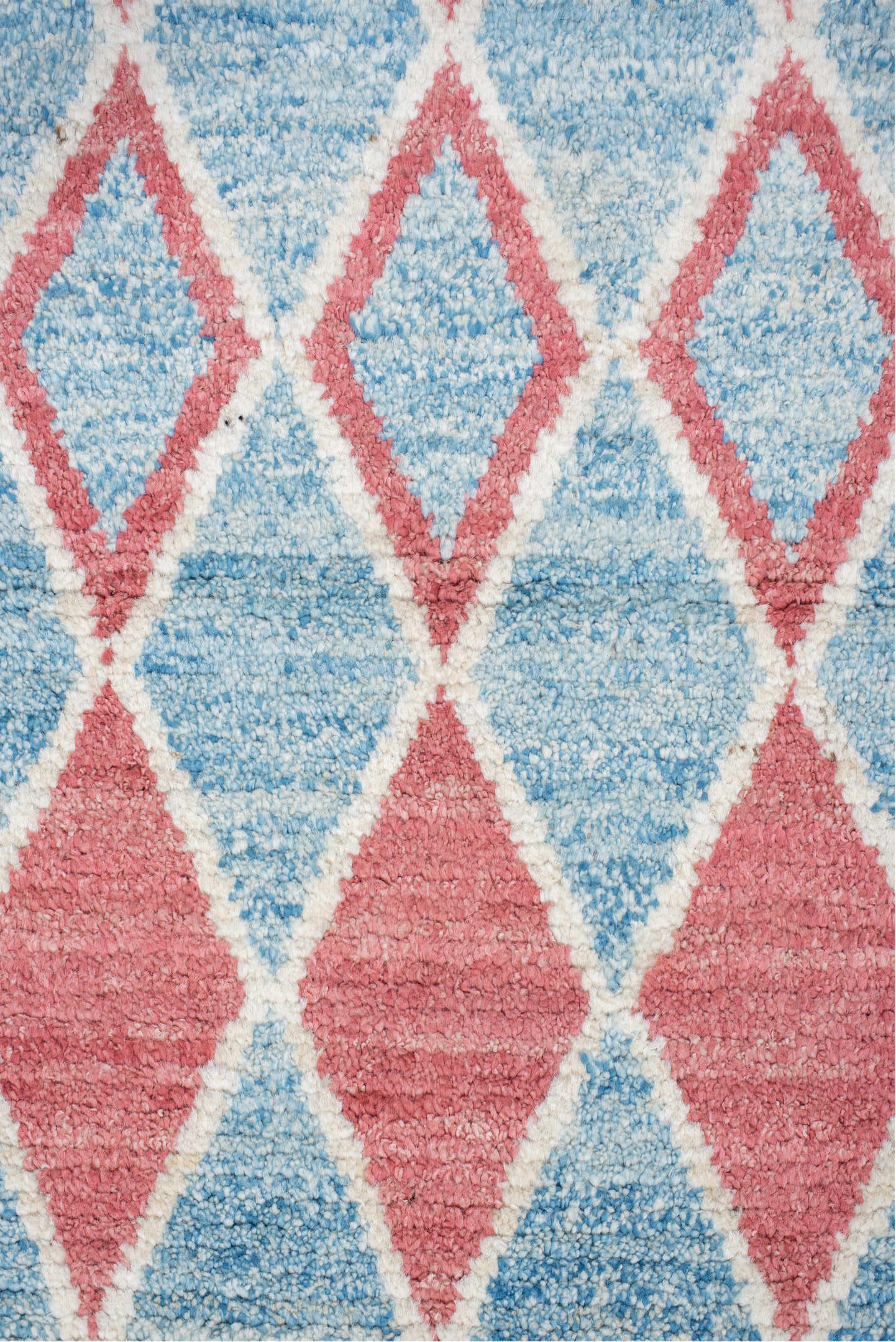 3' x 9' one-of-a-kind handmade vintage Tulu runner rug. Color palette: gray, light gray, pink, off-white, red, brown