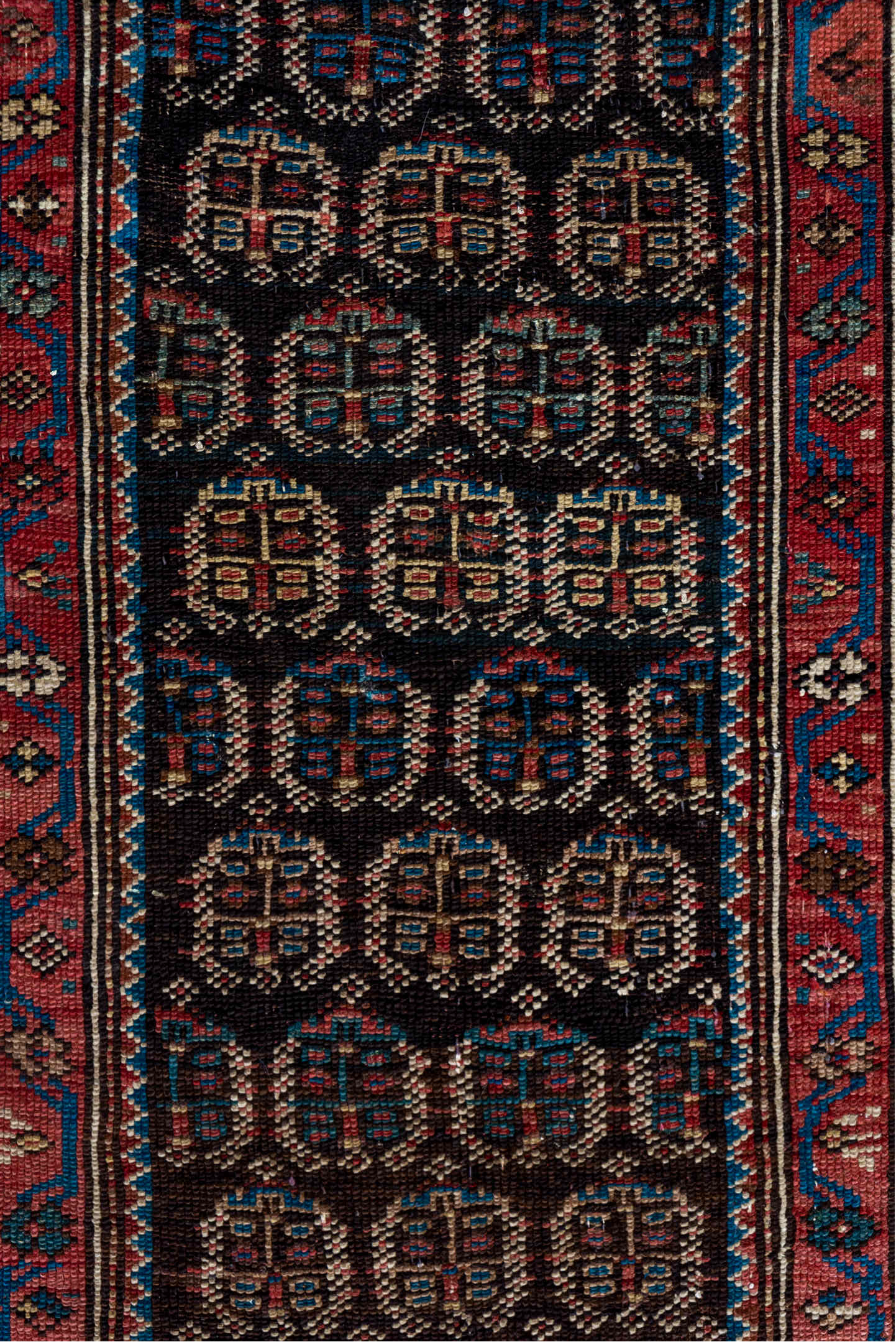 2' x 12' one-of-a-kind handmade vintage Caucasian runner rug. Color palette: black, brown, charcoal, gray, off-white, pink