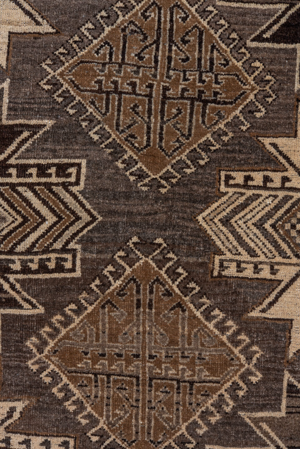 7' x 9' one-of-a-kind handmade vintage Afghan rug. Color palette: black, brown, charcoal, gray, light gray, off-white, pink