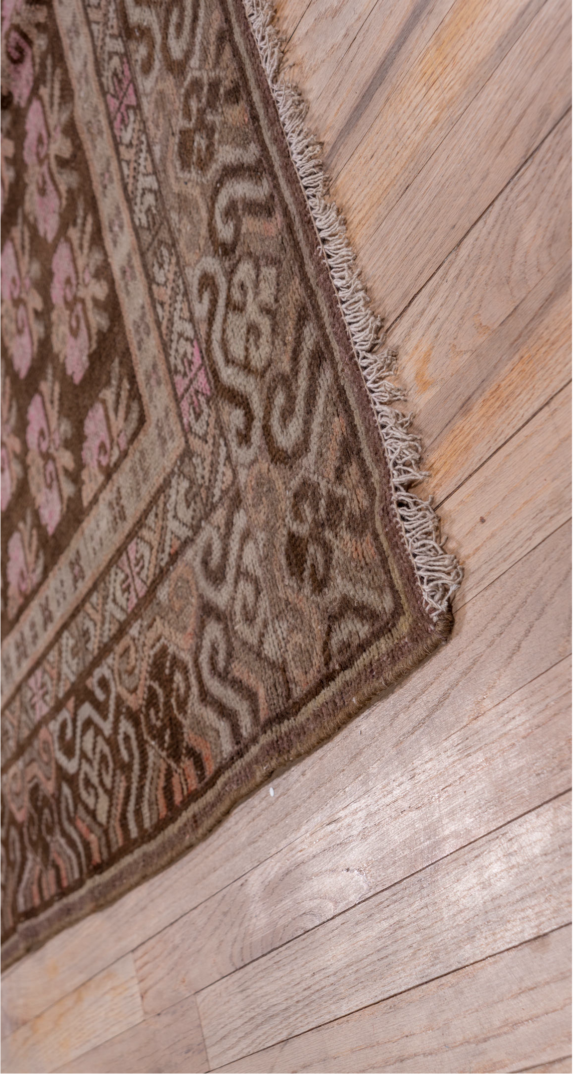 4' x 9' one-of-a-kind handmade vintage Khotan rug. Color palette: brown, gray, pink, redwood