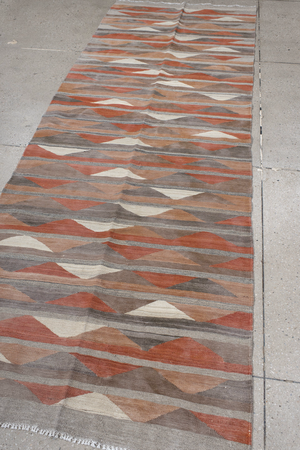 3' x 9' one-of-a-kind handmade vintage Kilim runner rug. Color palette: brown, gray, light gray, off-white, pink