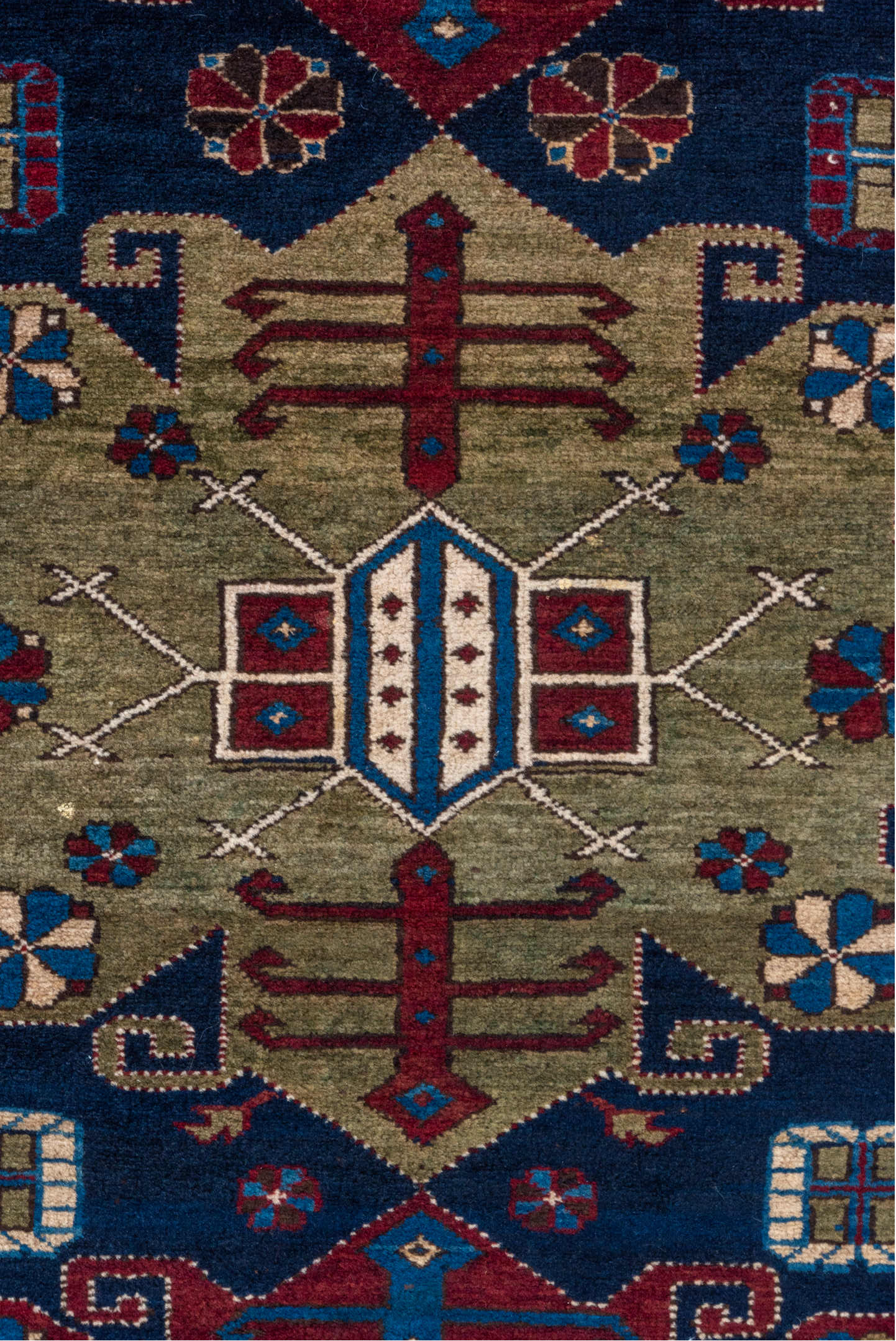 4' x 7' one-of-a-kind handmade vintage Caucasian rug. Color palette: black, blue, brown, gray, light gray, off-white, red