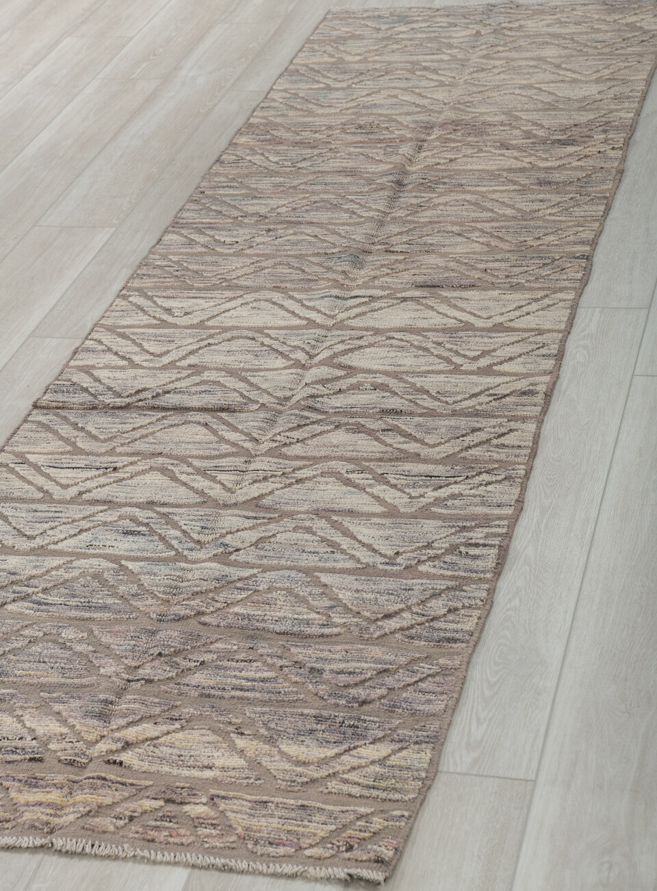 2' x 10' one-of-a-kind handmade vintage Tulu runner rug. Color palette: black, dark gray, gray, light gray, off-white, pink