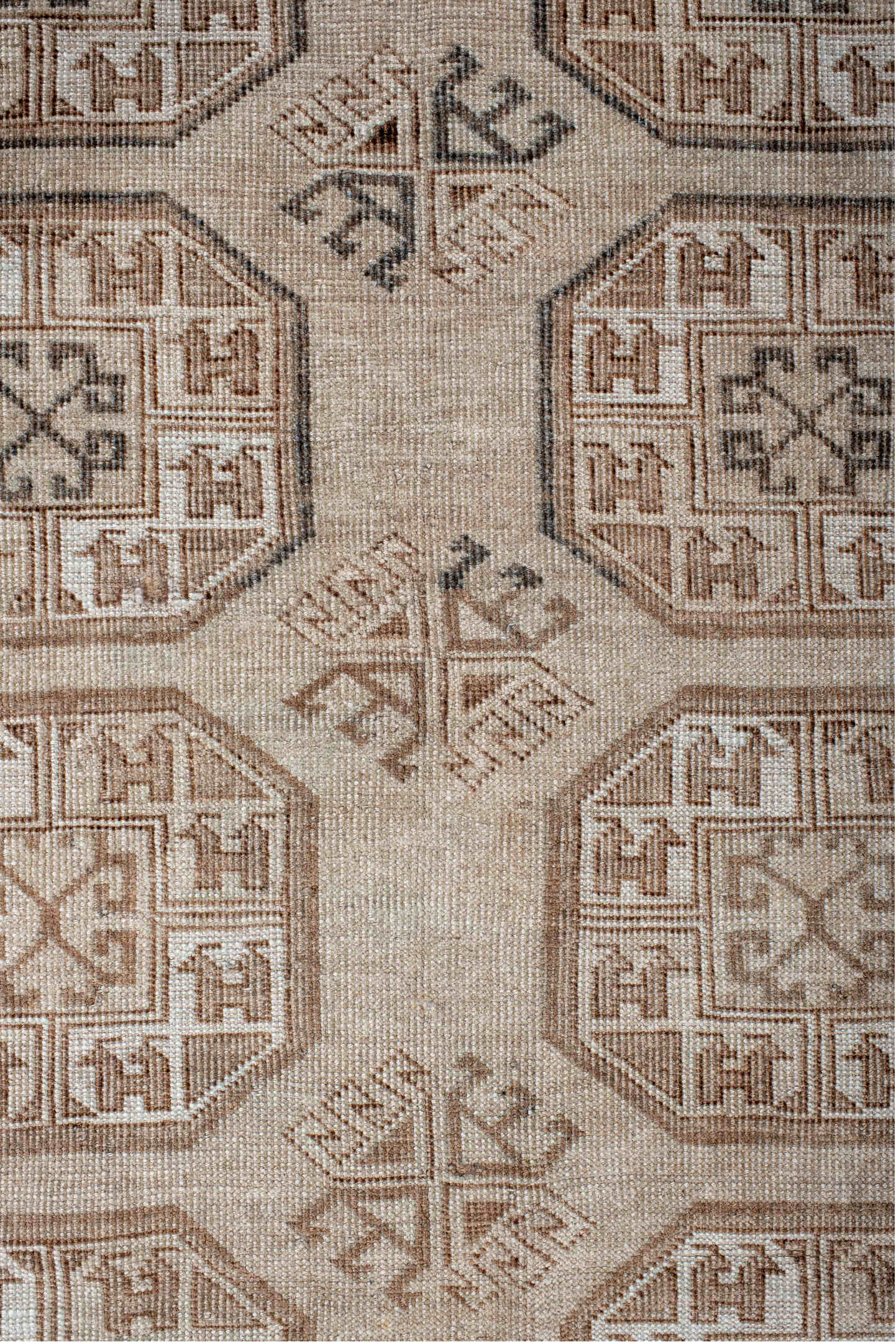 5' x 7' one-of-a-kind handmade vintage Afghan rug. Color palette: black, brown, gray, light gray, off-white, pink, silver