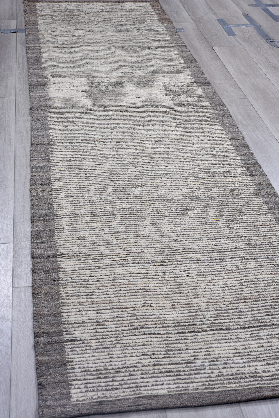 3' x 11' one-of-a-kind handmade vintage Tulu runner rug. Color palette: light gray, gray, off-white, blue, black, silver