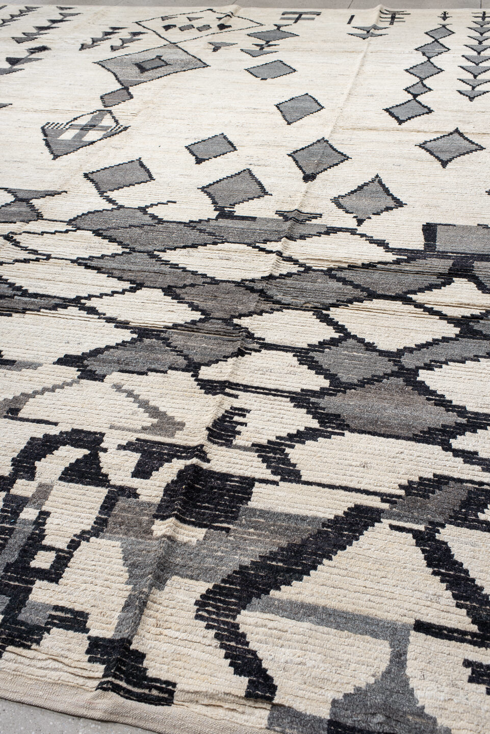 13' x 17' one-of-a-kind handmade vintage Tulu oversize rug. Color palette: black, charcoal, dark gray, dim gray, gray