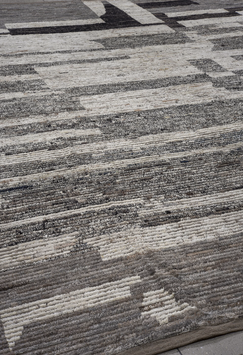 13' x 15' one-of-a-kind handmade vintage Tulu oversize rug. Color palette: black, brown, charcoal, gray, pink, red