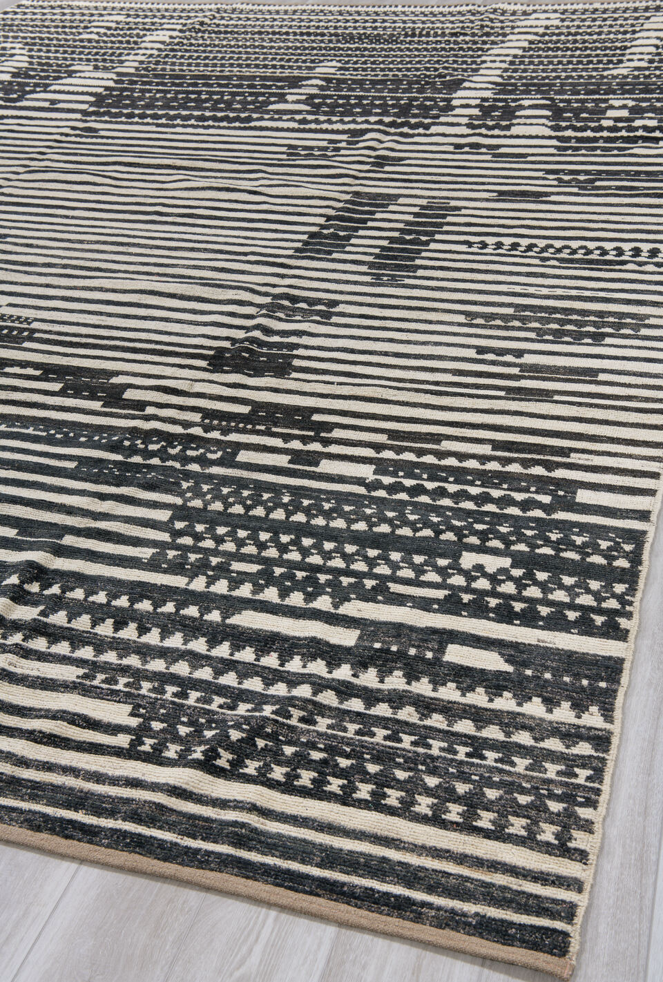 10' x 13' one-of-a-kind handmade vintage Tulu large size rug. Color palette: black, blue, brown, charcoal, dark gray