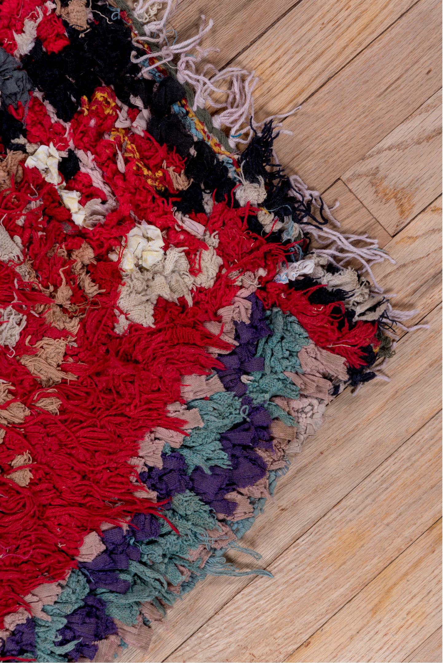 4' x 6' one-of-a-kind handmade vintage Moroccan small size rug. Color palette: brown, blue, gray, pink, red, off-white