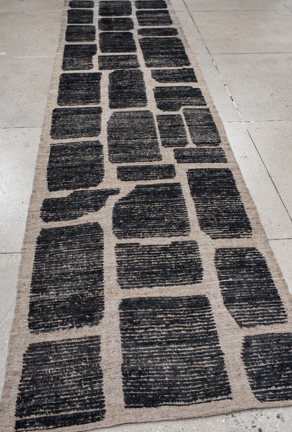 3' x 12' one-of-a-kind handmade vintage Tulu runner rug. Color palette: black, blue, dim gray, gray, light gray, off-white