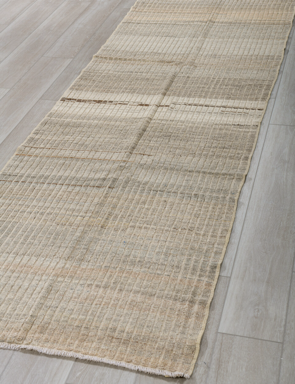 3' x 9' one-of-a-kind handmade vintage Tulu runner rug. Color palette: dark gray, gray, light gray, off-white, silver