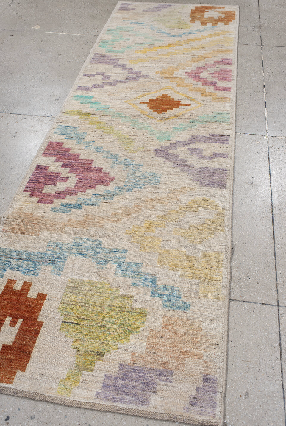 3' x 9' one-of-a-kind handmade vintage Tulu runner rug. Color palette: light gray, off-white, gray, blue, brown, pink