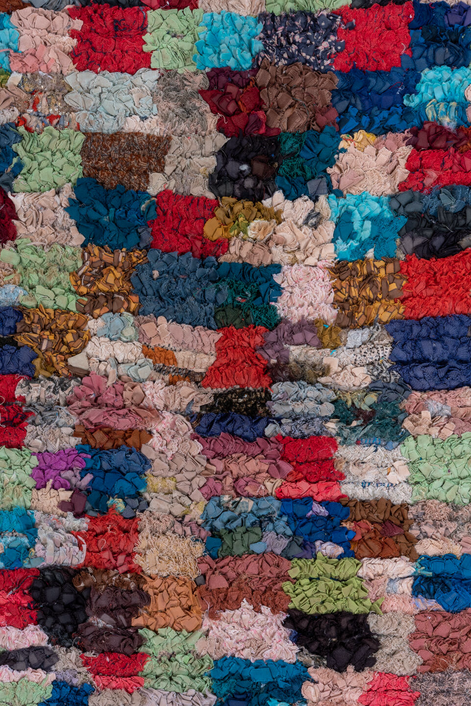 4' x 6' one-of-a-kind handmade vintage Rag Rug small size rug. Color palette: black, blue, brown, cadet blue, fire brick