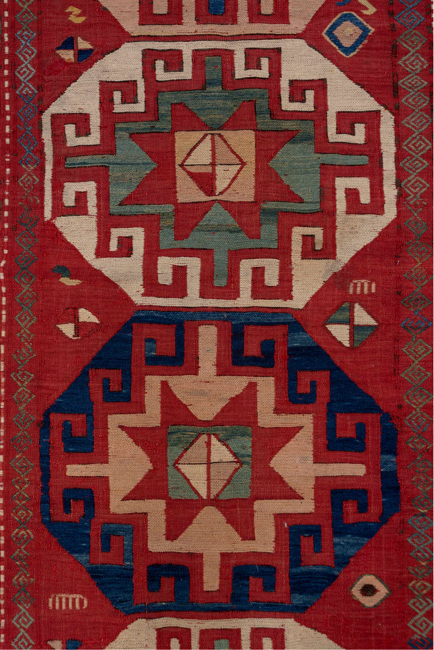 5' x 8' one-of-a-kind handmade vintage Sumak medium size rug. Color palette: blue, brown, fiord, gray, pink, red