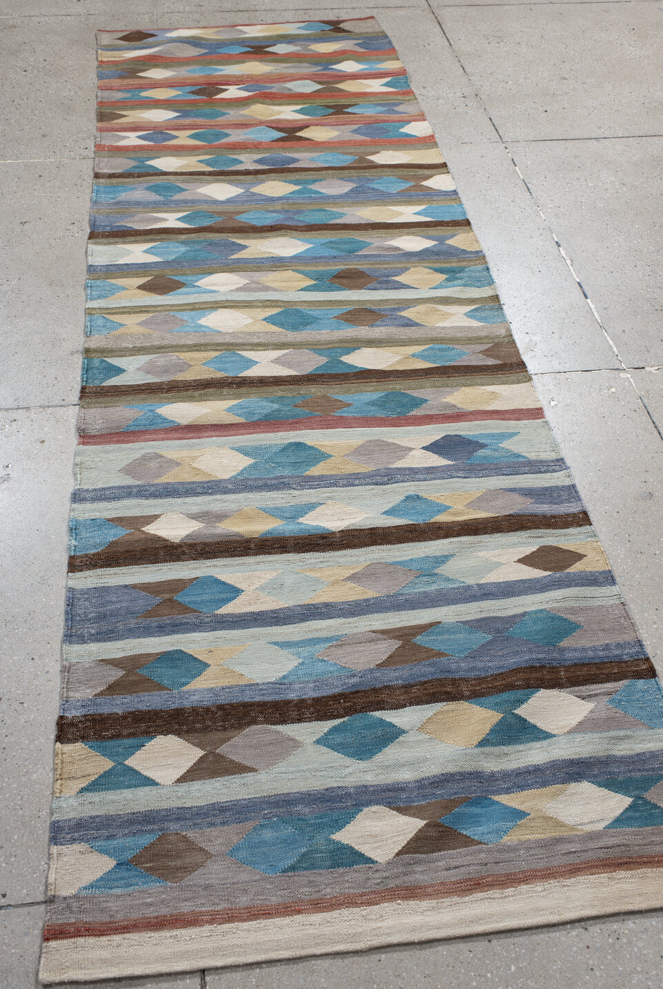 2' x 9' one-of-a-kind handmade vintage Kilim runner rug. Color palette: gray, brown, red, light blue, light gray, pink