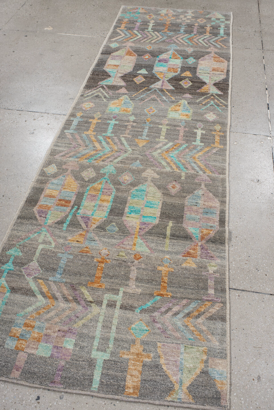 2' x 9' one-of-a-kind handmade vintage Tulu runner rug. Color palette: light gray, off-white, gray, blue, brown, green