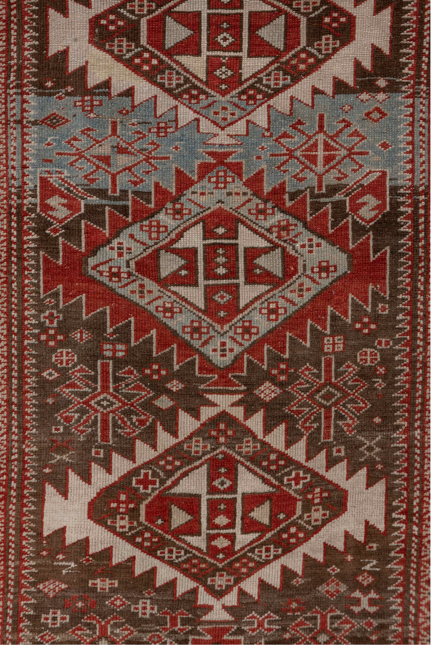 2' x 6' one-of-a-kind handmade vintage Shirvan runner rug. Color palette: brown, pink, red