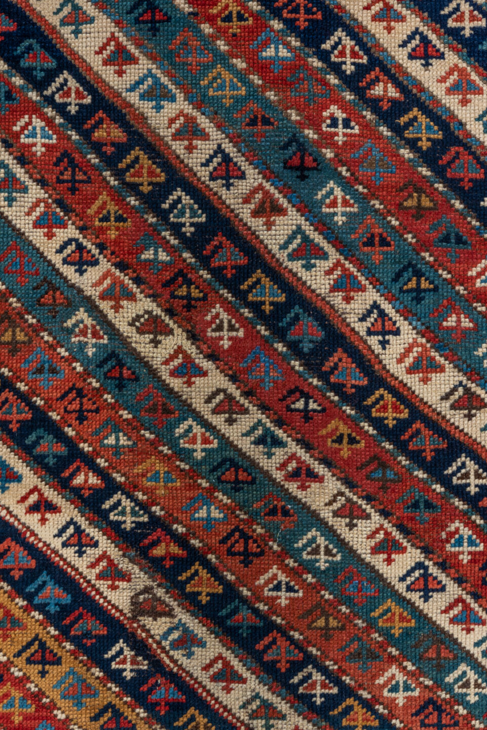 4' x 9' one-of-a-kind handmade vintage Kazak runner rug. Color palette: arapawa, black, blue, brown, gray, orange, red, tan