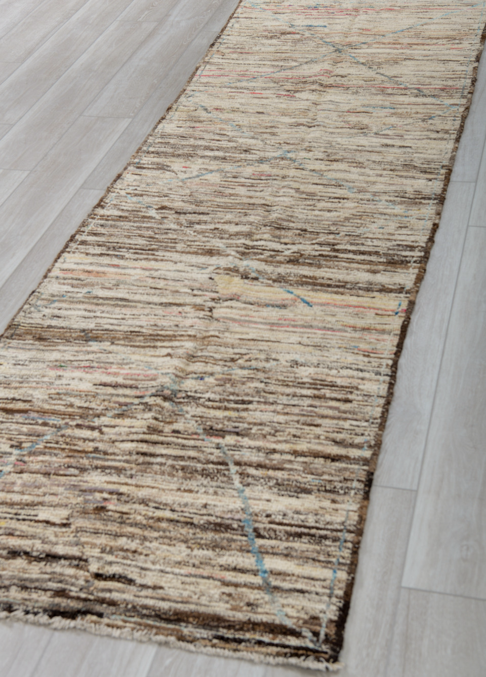 3' x 10' one-of-a-kind handmade vintage Tulu runner rug. Color palette: black, brown, gray, light gray, off-white, silver