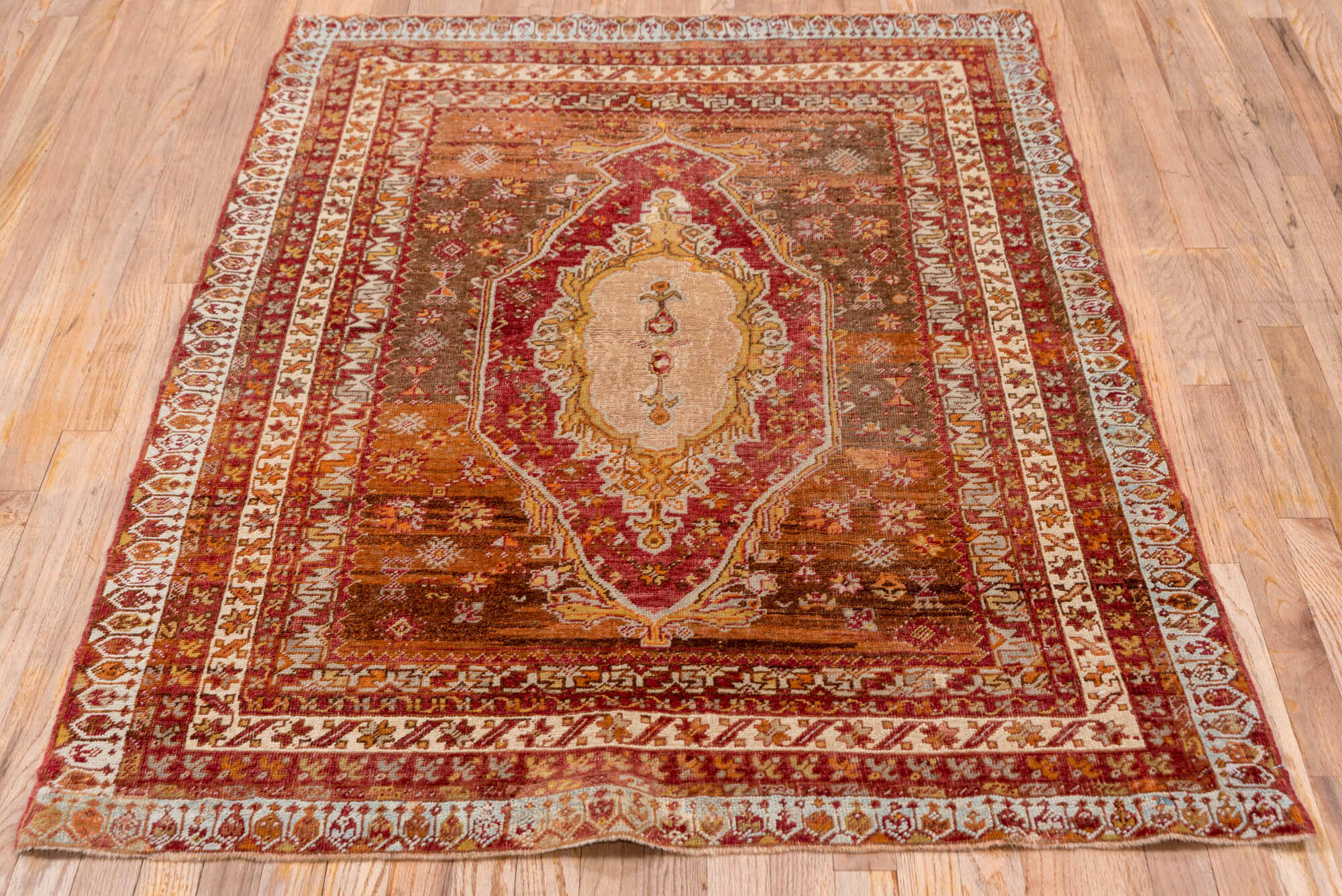 3' x 5' one-of-a-kind handmade vintage Sivas small size rug. Color palette: brown, gray, light gray, off-white, orange, pink