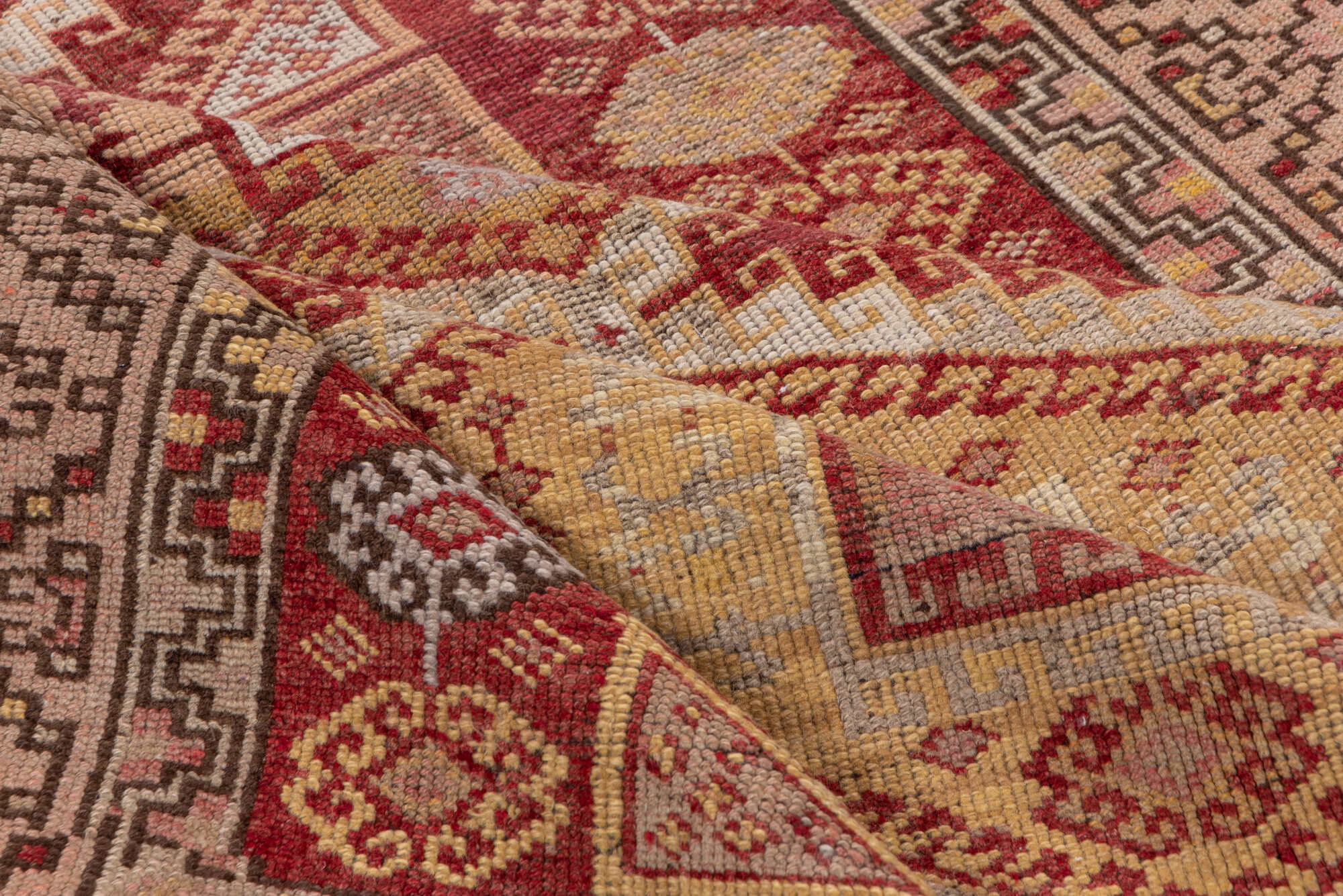 4' x 11' one-of-a-kind handmade vintage Kurd runner rug. Color palette: brown, pink, red