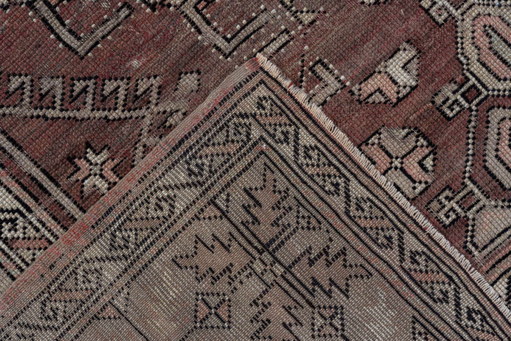 5' x 7' one-of-a-kind handmade vintage Oushak rug. Color palette: black, brown, gray, light gray, pink