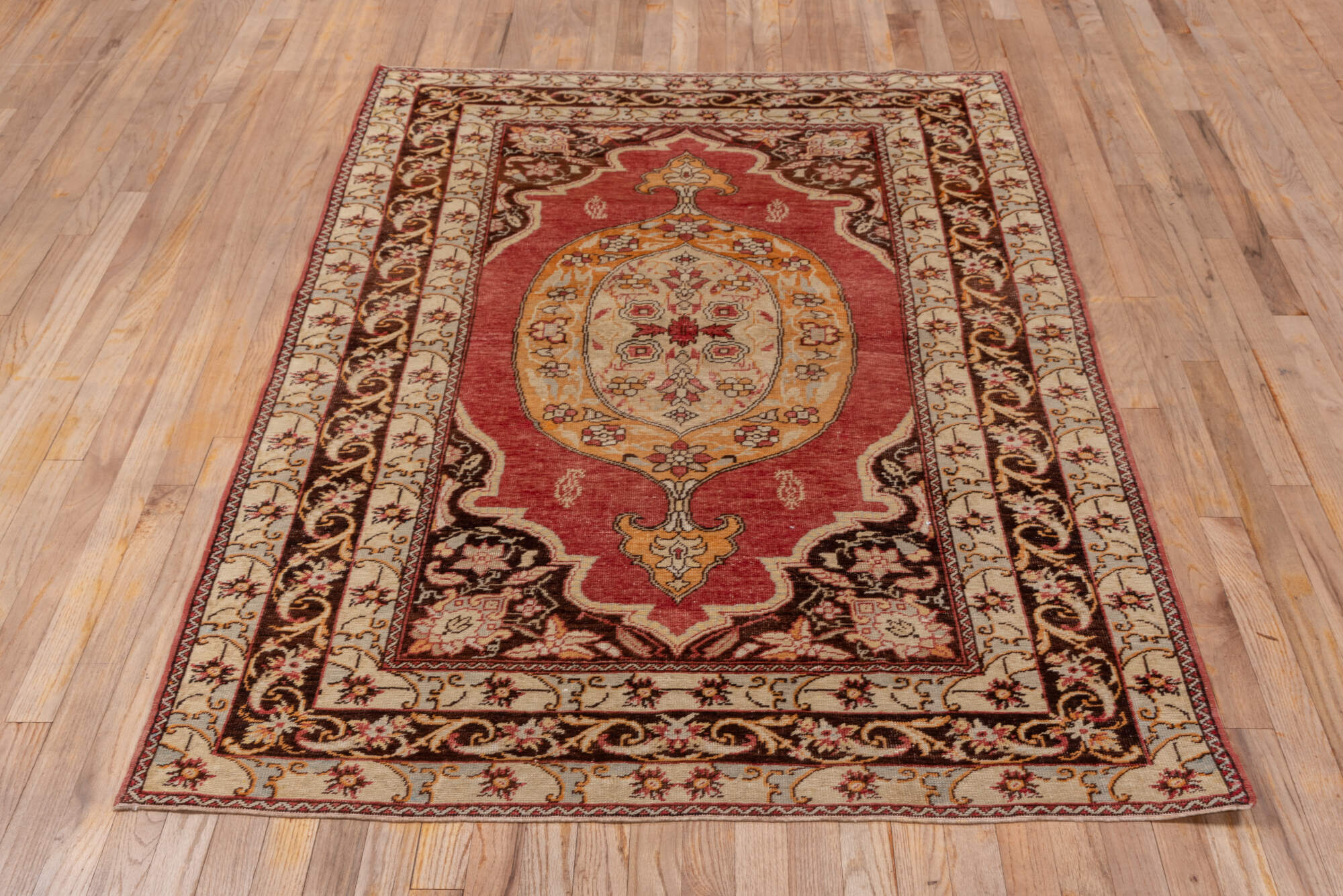 4' x 6' one-of-a-kind handmade vintage Oushak small size rug. Color palette: black, brown, pink, red, saddle brown