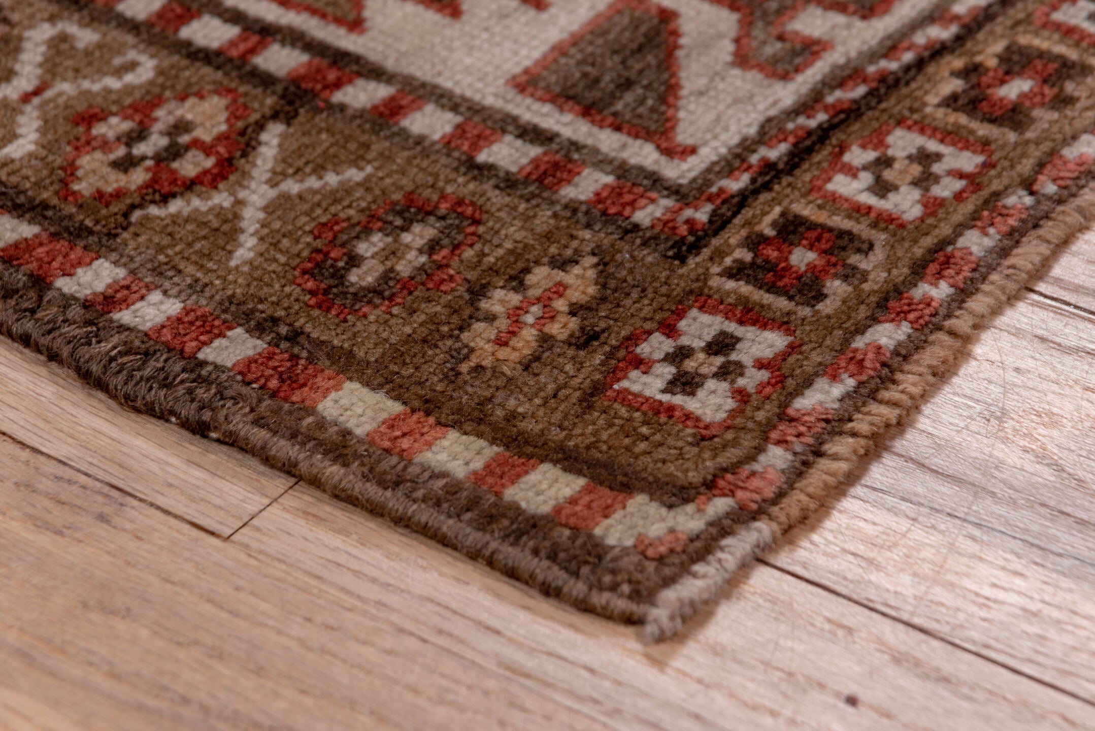 4' x 9' one-of-a-kind handmade vintage Kurd runner rug. Color palette: brown, gray, blue, pink, light gray, arapawa