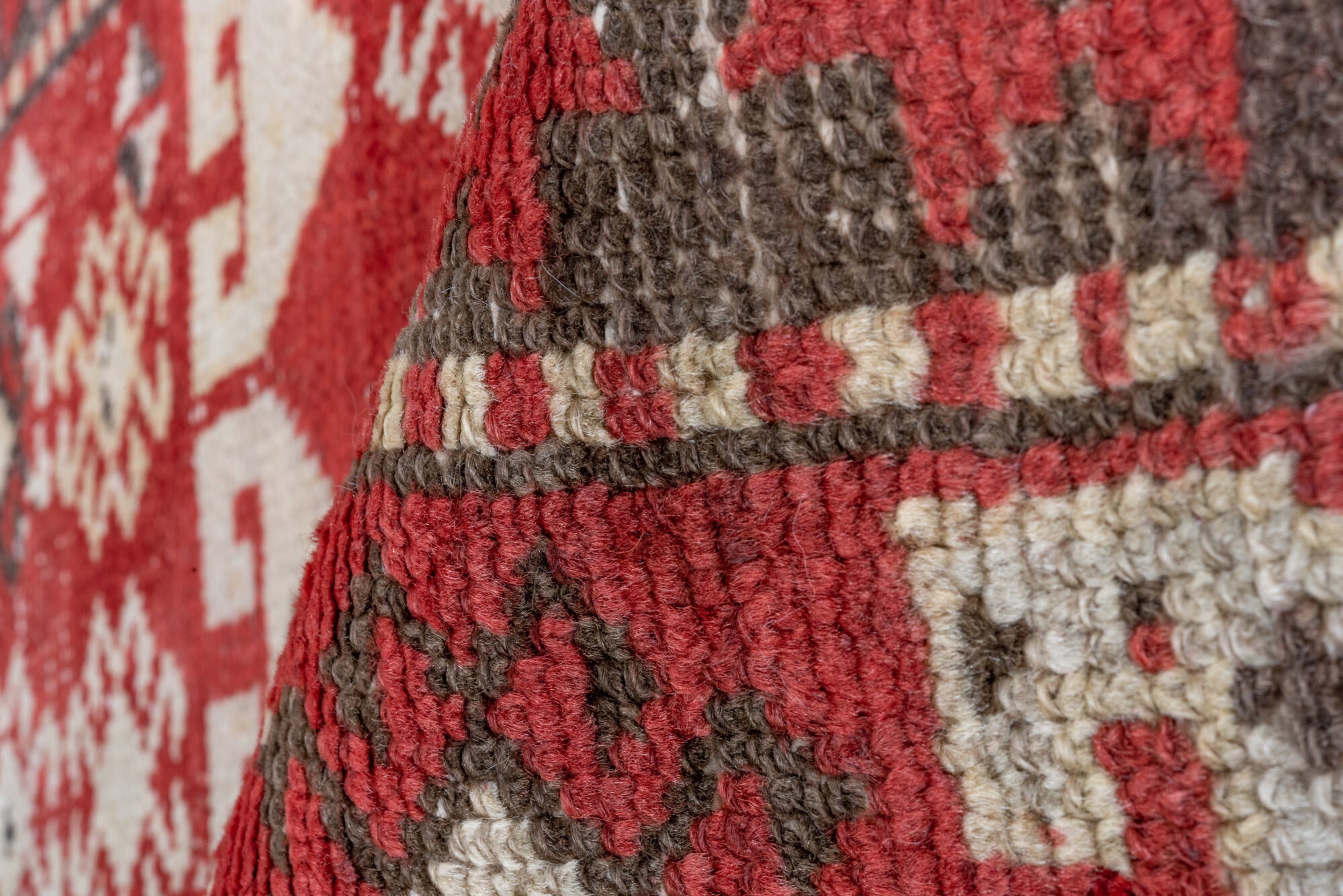 4' x 13' one-of-a-kind handmade vintage Caucasian runner rug. Color palette: brown, gray, pink, red