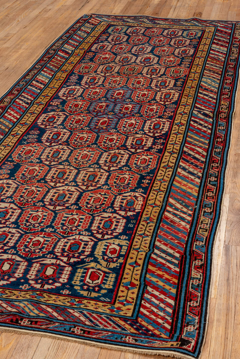 3' x 9' one-of-a-kind handmade vintage Kuba runner rug. Color palette: brown, blue, gray, orange, red, pink, arapawa